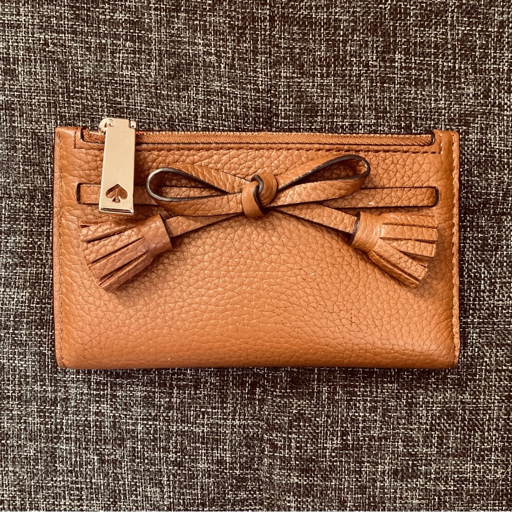 Kate Spade Hayes Tassel Mikey Slim bifold wallet in Warm Gingerbread
